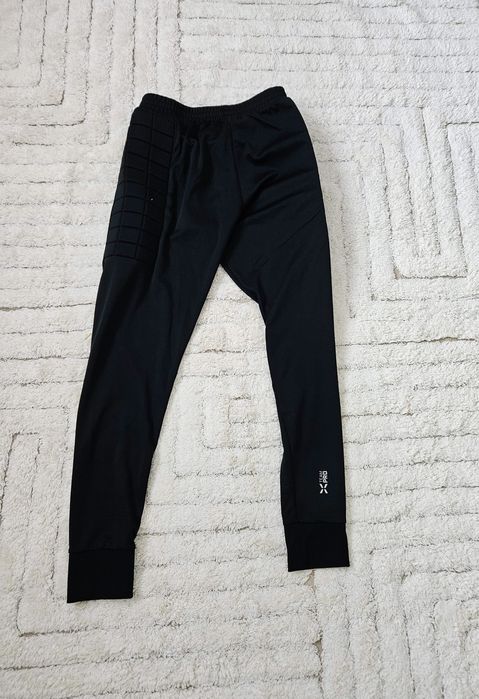 Spodnie piłkarskie Huari XL ochraniacze