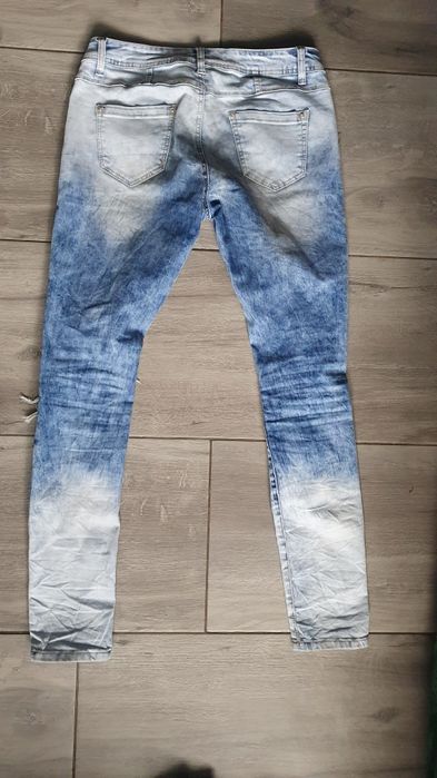 Niebieskie modne jeansy dżinsy denim skinny z dziurami rozdarciami L