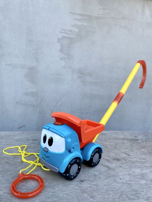 Музична Вантажіка Льова іграшка каталка з палицею / Грузовичок Лёва