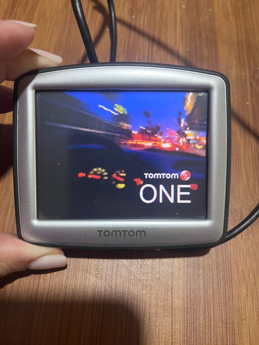 GPS tomtom e máquina fotográfica