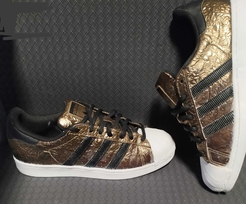 Adidas Superstar metallic foil gold.