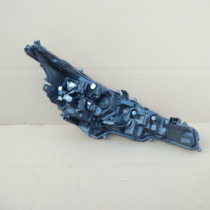 Toyota Corolla XII E21 kombi HB lampa lewa reflektor oryginał EU