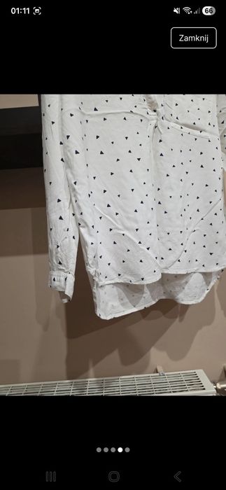 Biała bluzka na guziki w trójkąty