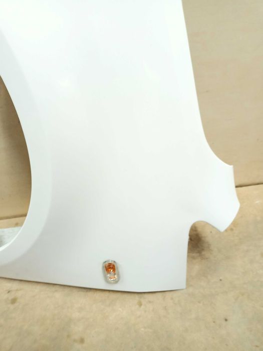 VW Caddy Touran 1 3 lift 2014r. błotnik lewy przód przedni biały