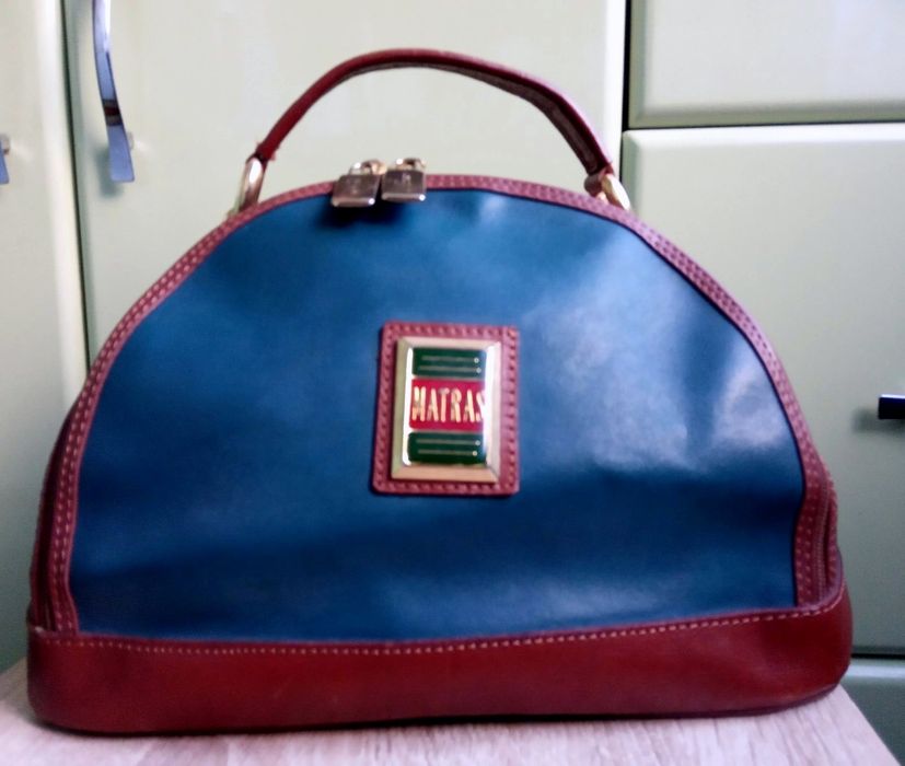 Шкіряна вмістима сумка