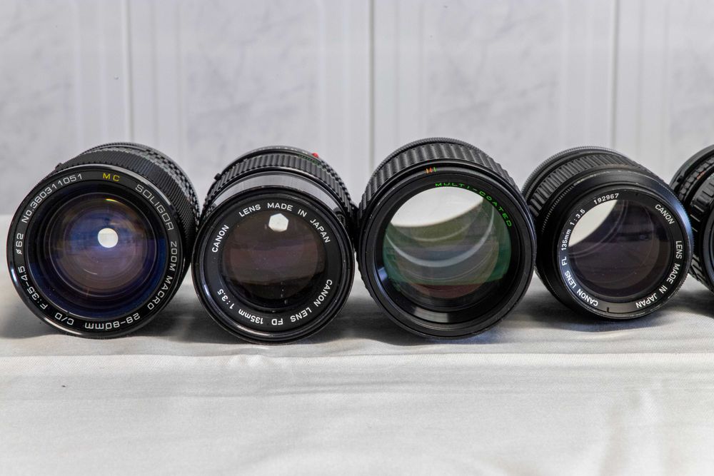 Lote de câmeras fotográficas+objetivas+acesórios