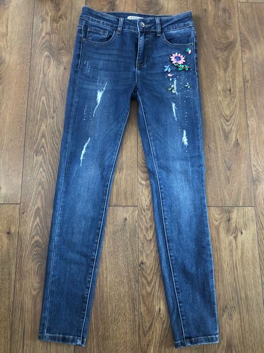 Jeansy skinny z ozdobną aplikacją