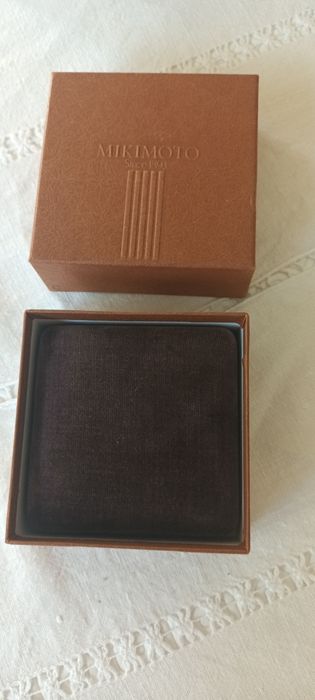 Negócio de oportunidade. Botões de punho Mikimoto