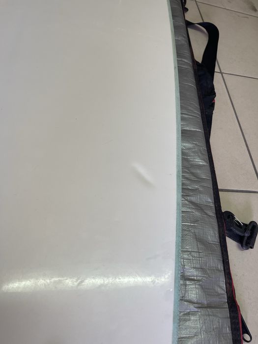 Prancha de surf Ocean & Earth Happy Hour Epoxy Softop 7.0 (52L) em bom estado geral, vendida com capa de proteção.