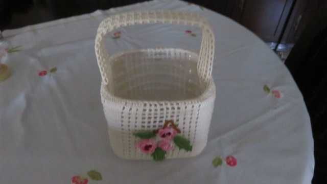 Entirely handmade lace basket with flowers.