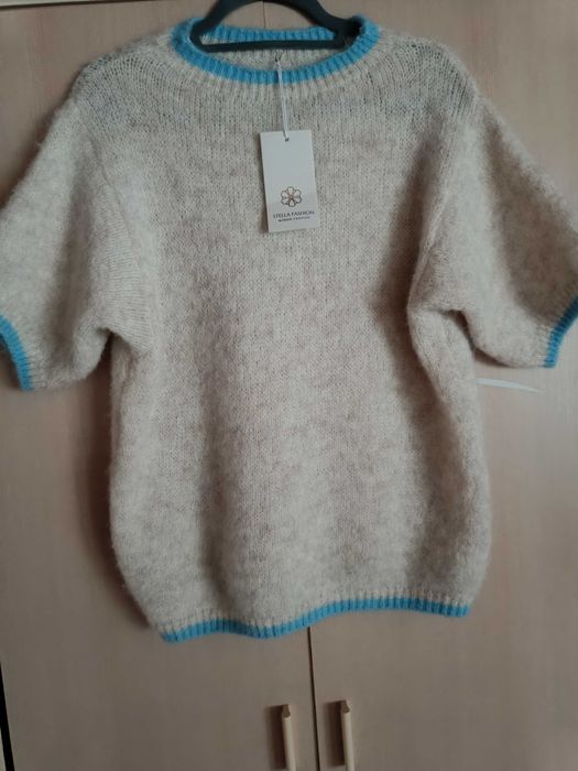 Nowy piękny  mięciutki Sweterek