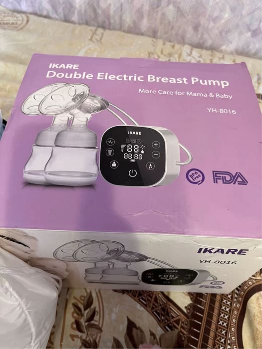 Новий подвійний молоковідсмоктувач