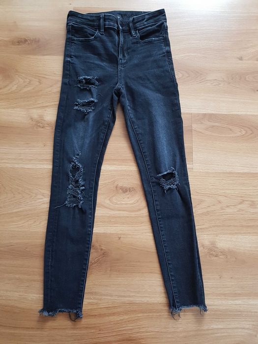 Czarne spodnie jeansowe z dziurami 34/36