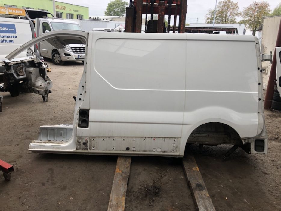 Bok błotnik tył tylny poszycie lewy L krótki Trafic Vivaro Primastar