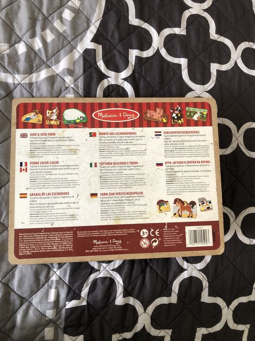 Książeczka drewniana Melissa & Doug okienka magnesy