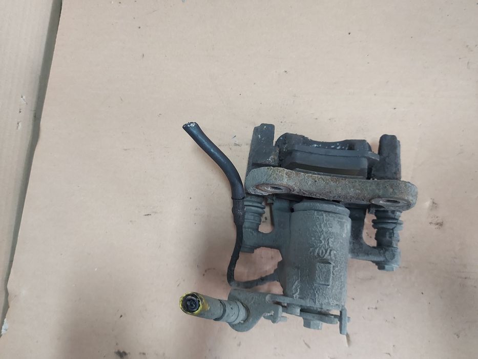 / Megane III 3 zacisk hamulcowy lewy tył