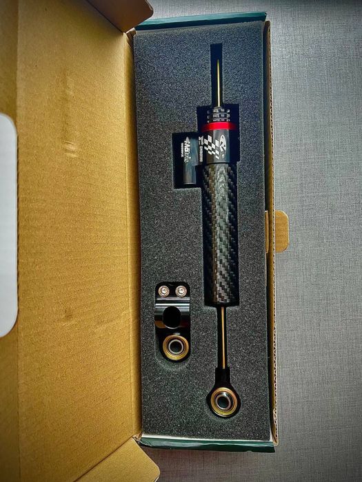 Демпфер рульовий карбоновий 25 см