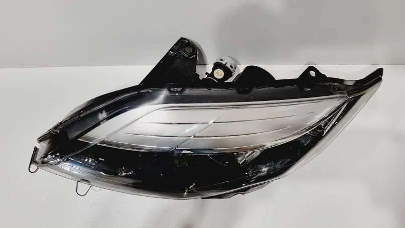 Reflektor lewy xenon Renault Laguna III lift europa