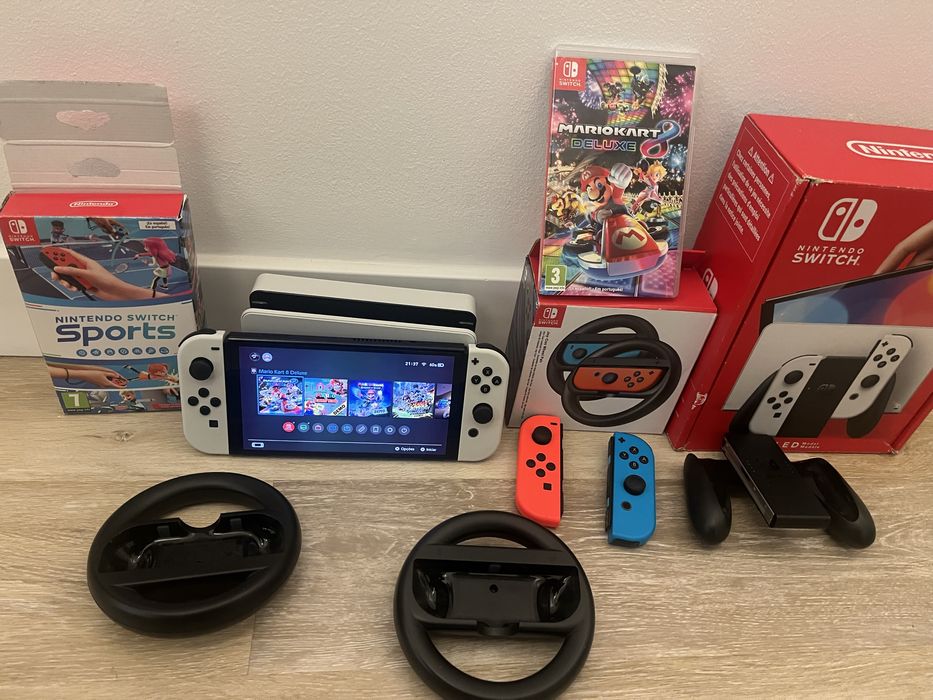 Nintendo Switch Oled + Mario Kart 8 + Sports +4 Joy Con + 2 Volantes