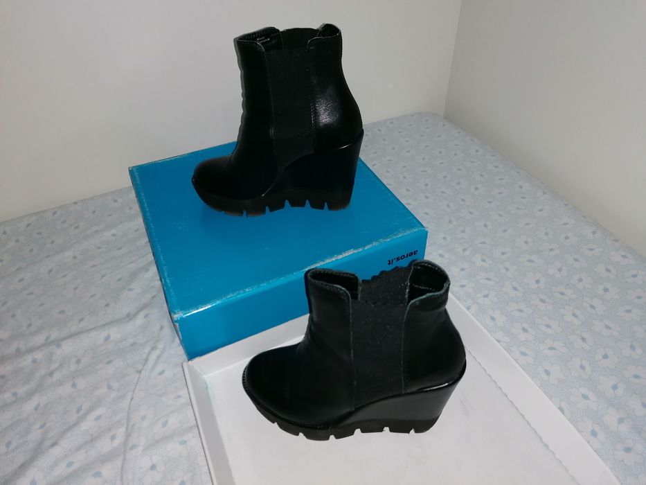 Botas pretas com salto