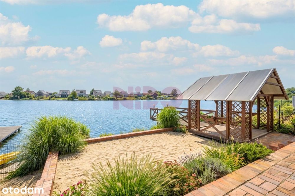 Działka rekreacyjna z całorocznym domkiem nad jeziorem- prywatna plaża