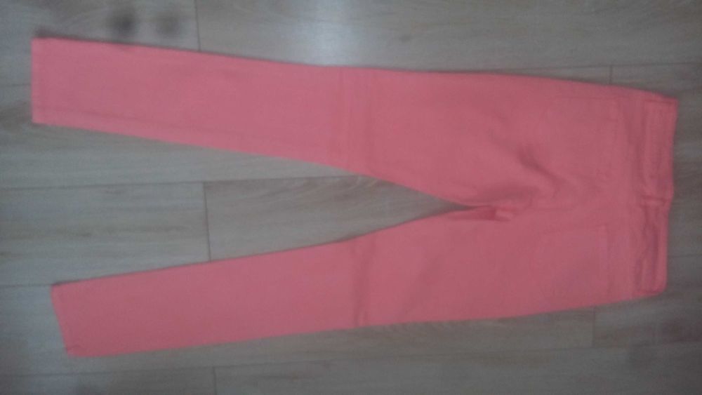 Spodnie roz. 34 neonowy koral