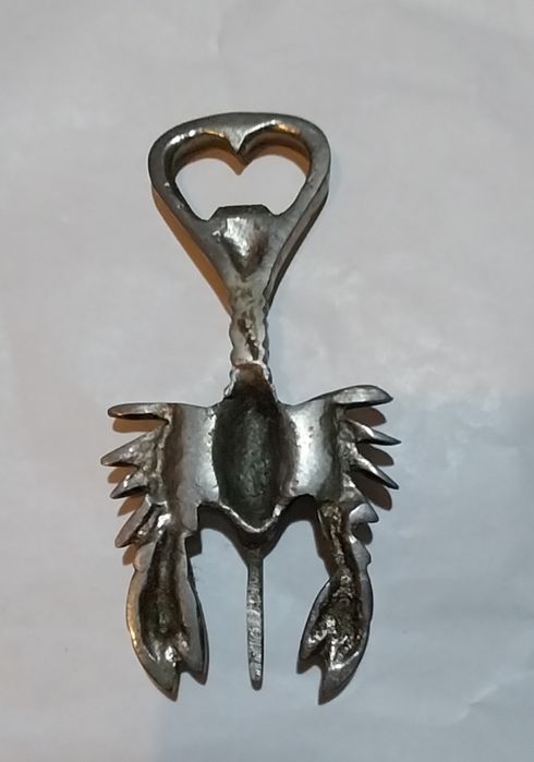 Abre cápsulas antigo em metal