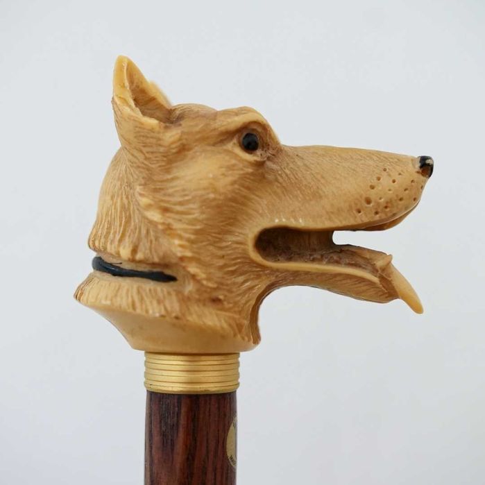 Bengala com cabeça de cão pastor esculpida