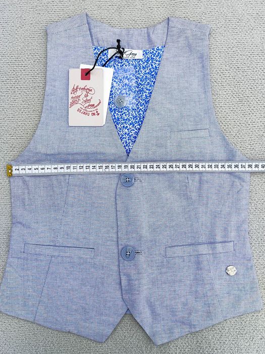 Піджаки, жилетки, кофтинки, гортайте фото