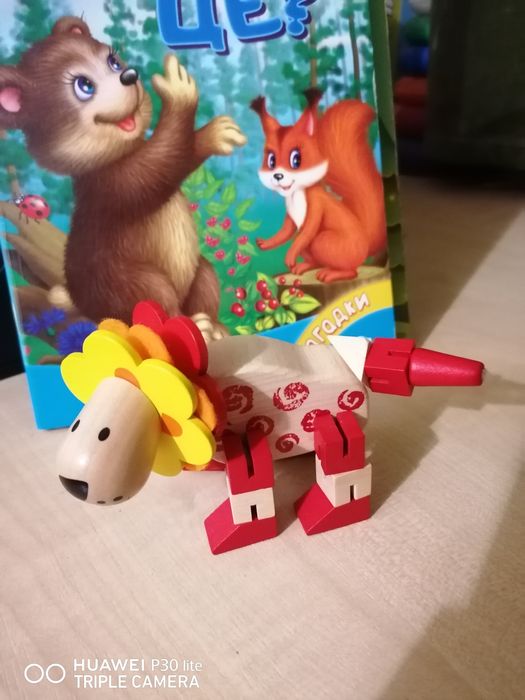 Дерев'яна розвиваюча іграшка лев.