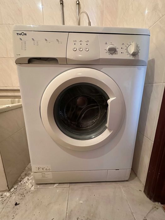 Máquina de lavar roupa usada