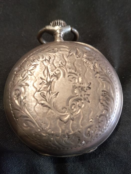 Omega de Bolso, em prata.