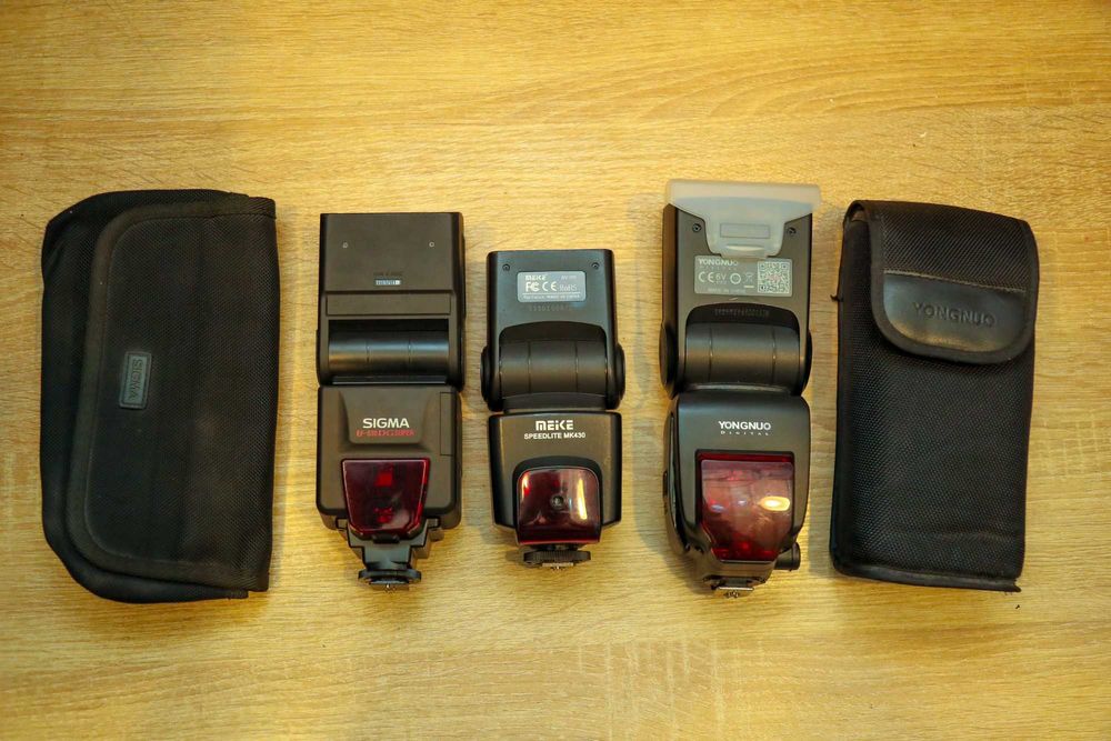 продаю 3 спалахи, об'єктив та відеокамеру