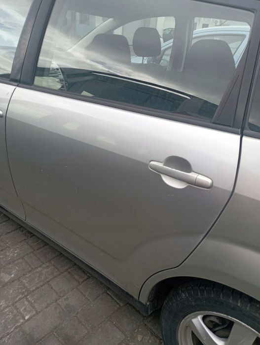 TOYOTA COROLLA VERSO II DRZWI LEWE TYŁ TYLNE GOŁE