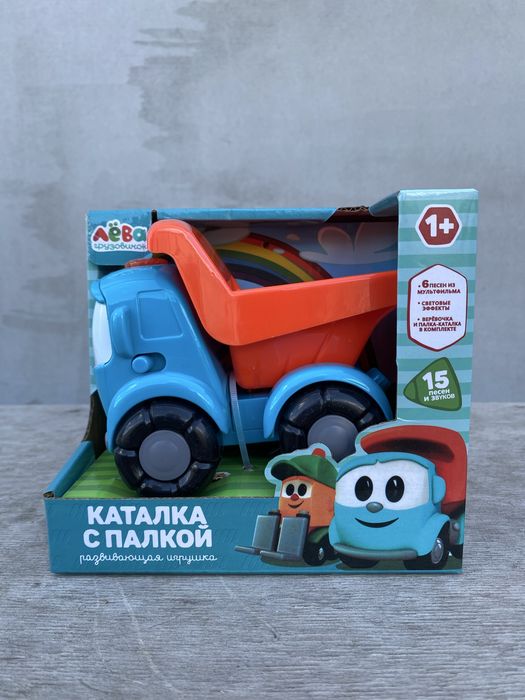 Музична Вантажіка Льова іграшка каталка з палицею / Грузовичок Лёва