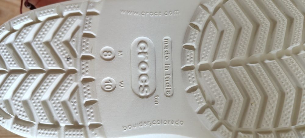 Nowe klapki CROCS beżowe z różowym napisem na tyle rozm.40,5