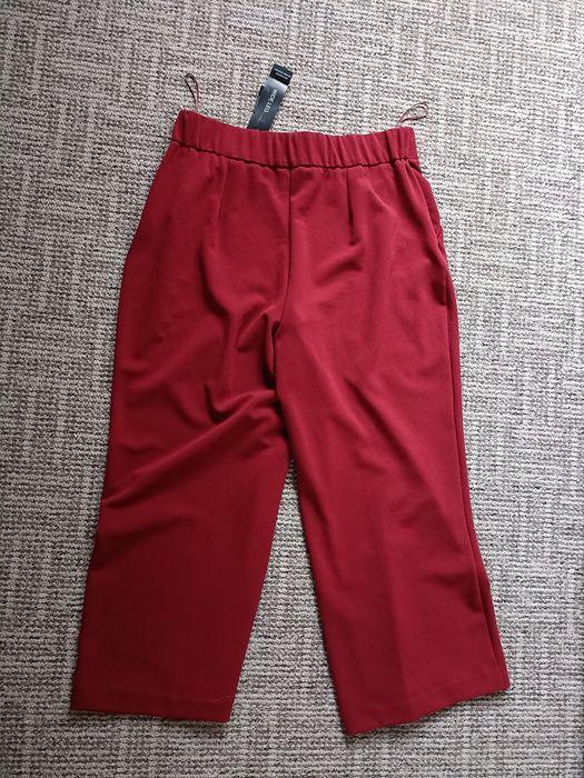 Materiałowe spodnie z szeroką nogawka