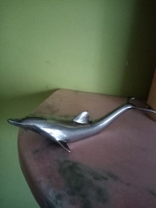 Stary otwieracz do butelek. Podwójny. Delfin