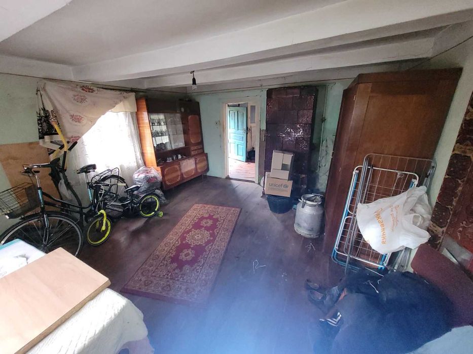 Дерев'яний будинок та земельна ділянка 14 сот. м. Кам'янка-Бузька