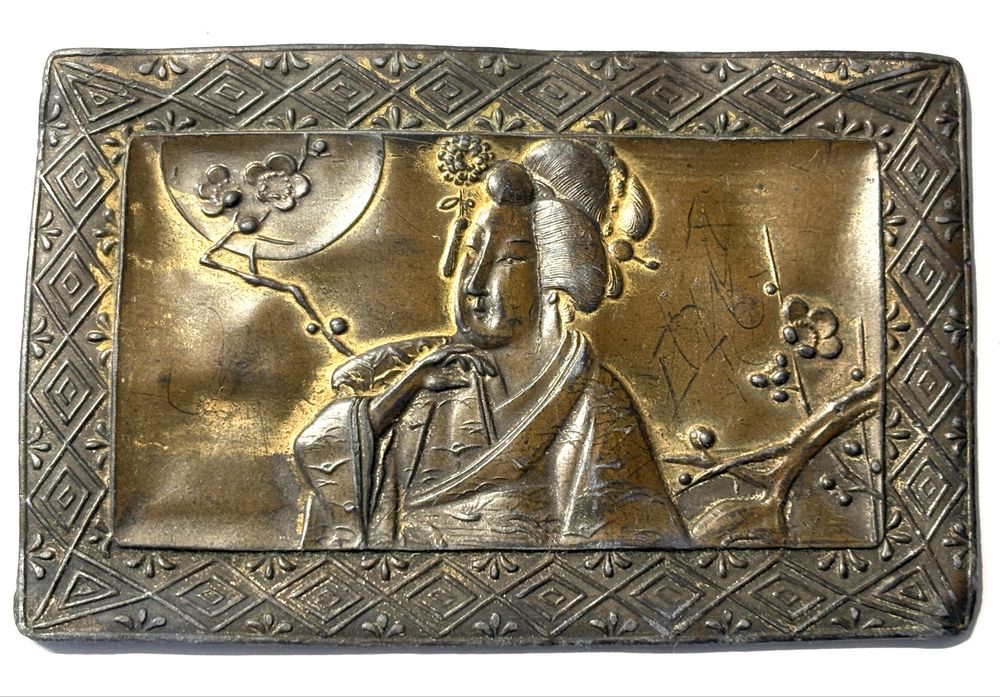 Beautiful antique Asian tin plaque featuring a Geisha image
