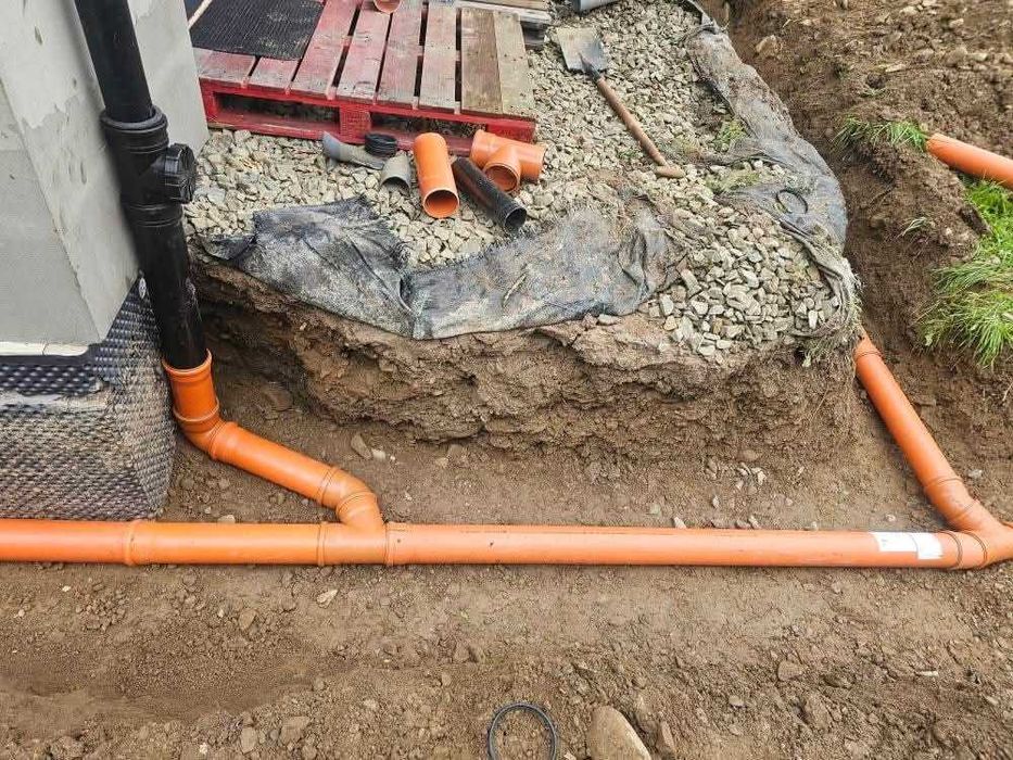 Usługi koparką odwodnienia budynków drenaż przydomowe oczyszczalnie