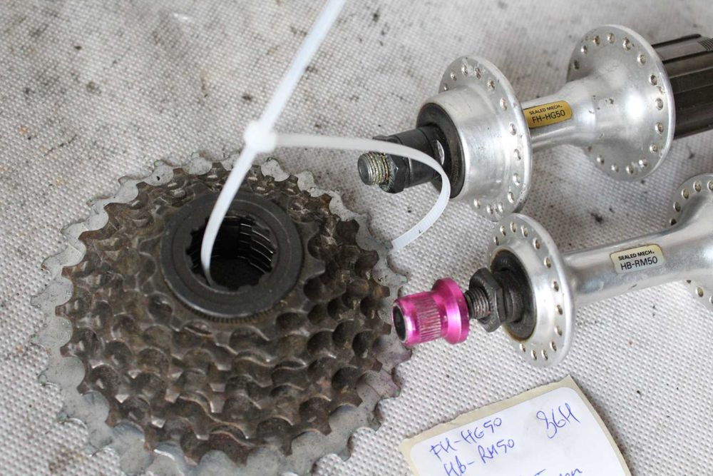 BUDŻET PIASTy rowerowe 7s 100/135mm 36H + kaseta hyperglide DB2
