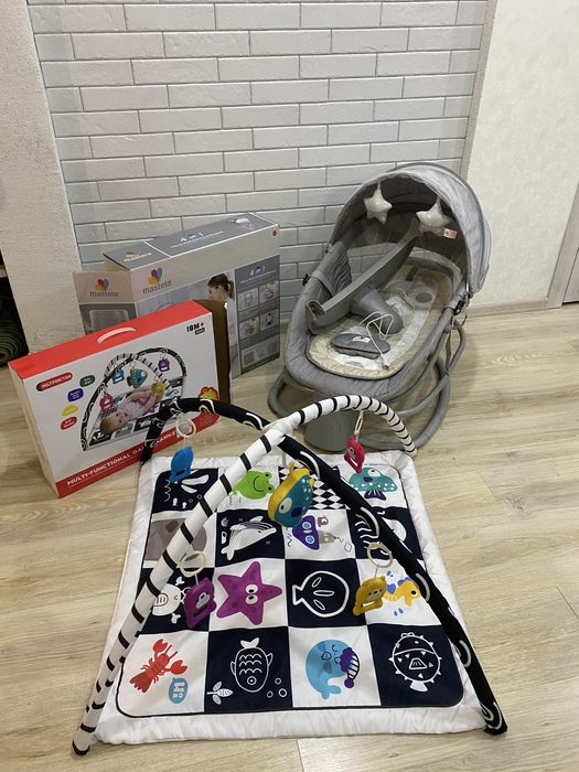 Коляска 2в1 та заколисуючий центр із розвиваючим килимком