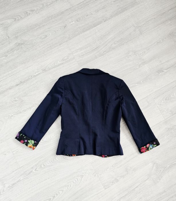 Piękna granatowa marynarka L 40 broszka