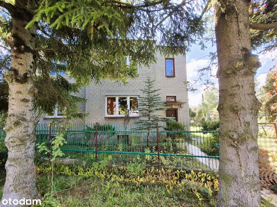 Przestronny dom z ogrodem i garażem – nieruchomość z potencjałem