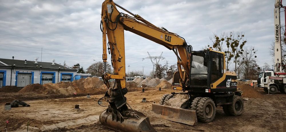 Caterpillar M312  Caterpillar M 312  stan bdb cały czas w użyciu