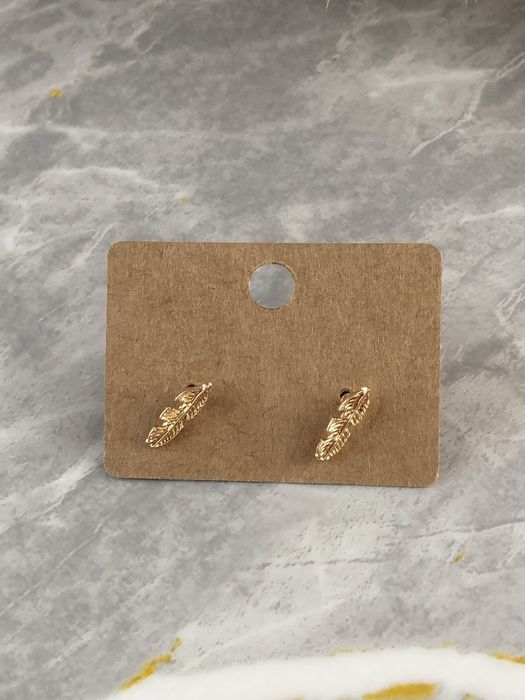 Złote kolczyki piórka