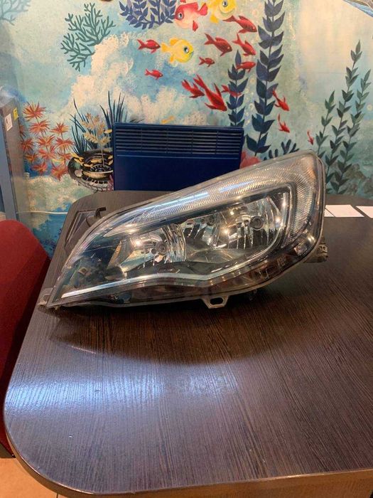 Фара левая  передняя Opel astra jiv. 13371601