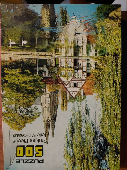 Caixa com 18 puzzles