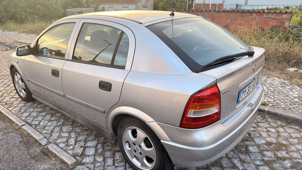 Opel 4 portas 165 mil km motor impecavel 2mil foto 3